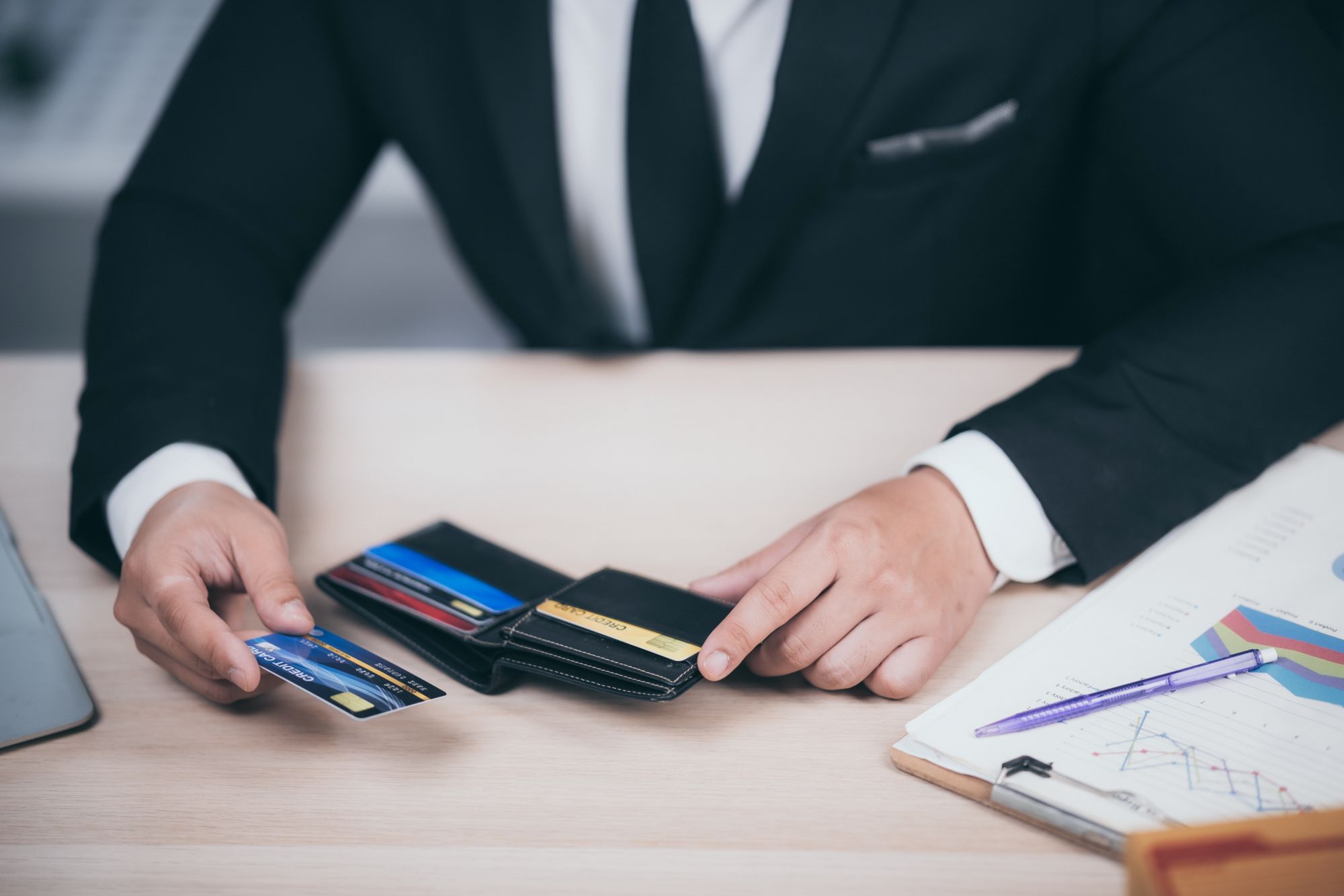 Business man holding a credit card