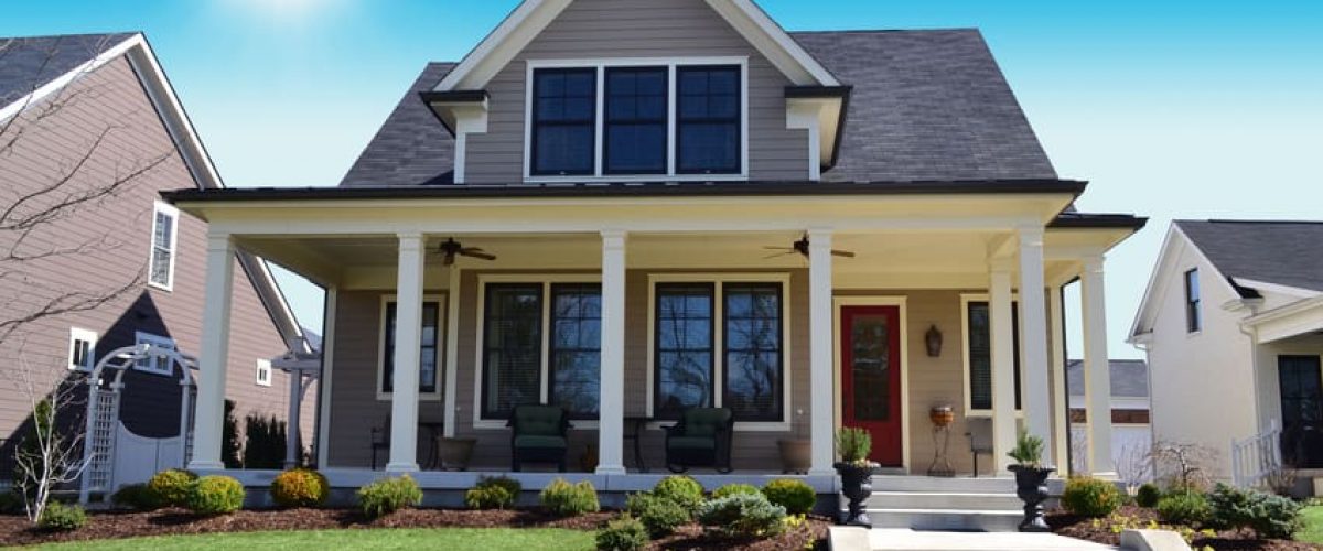 Photo of a house on a sunny street